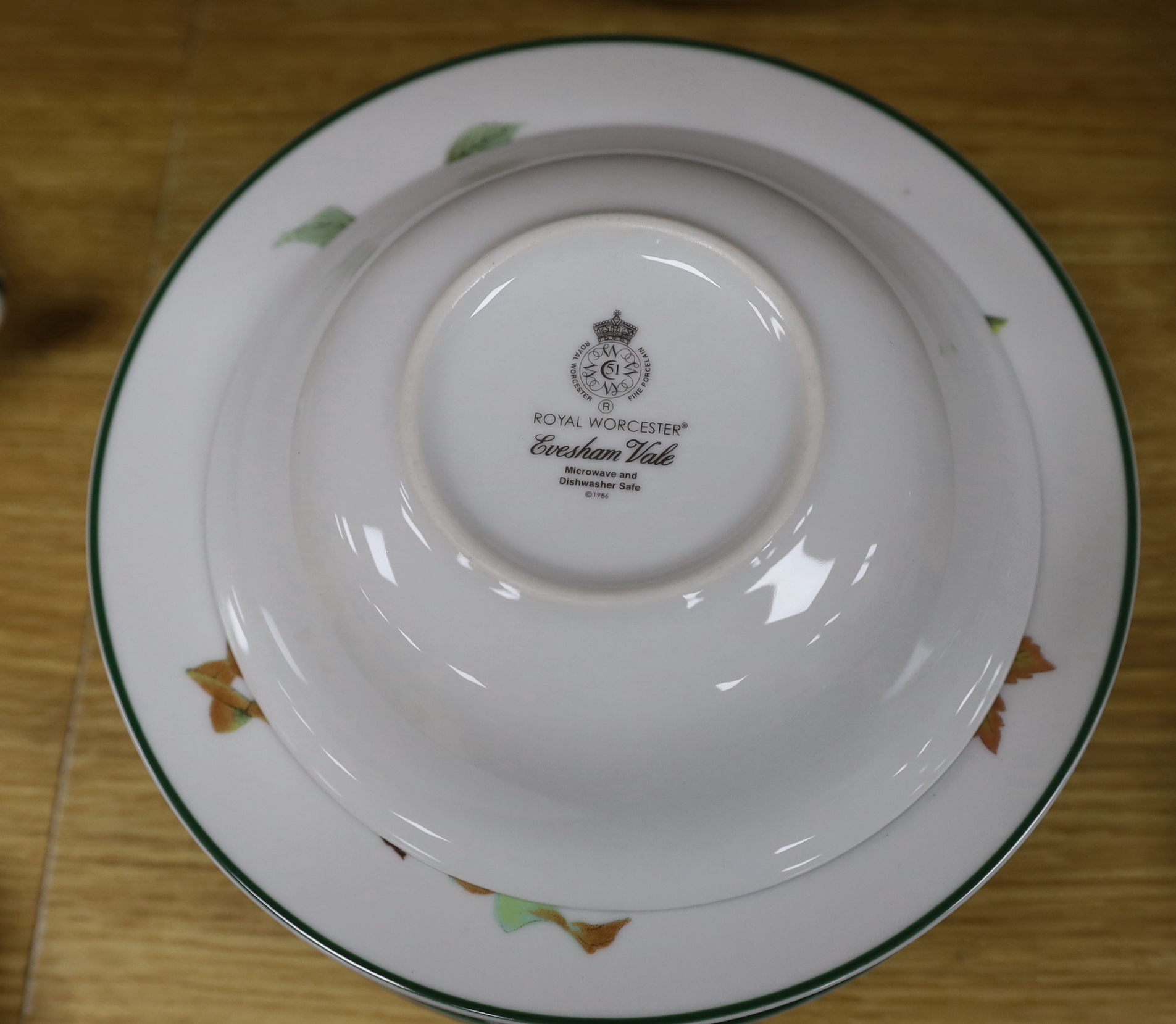A Royal Worcester “Evesham Vale” eight place setting, dinner and coffee service